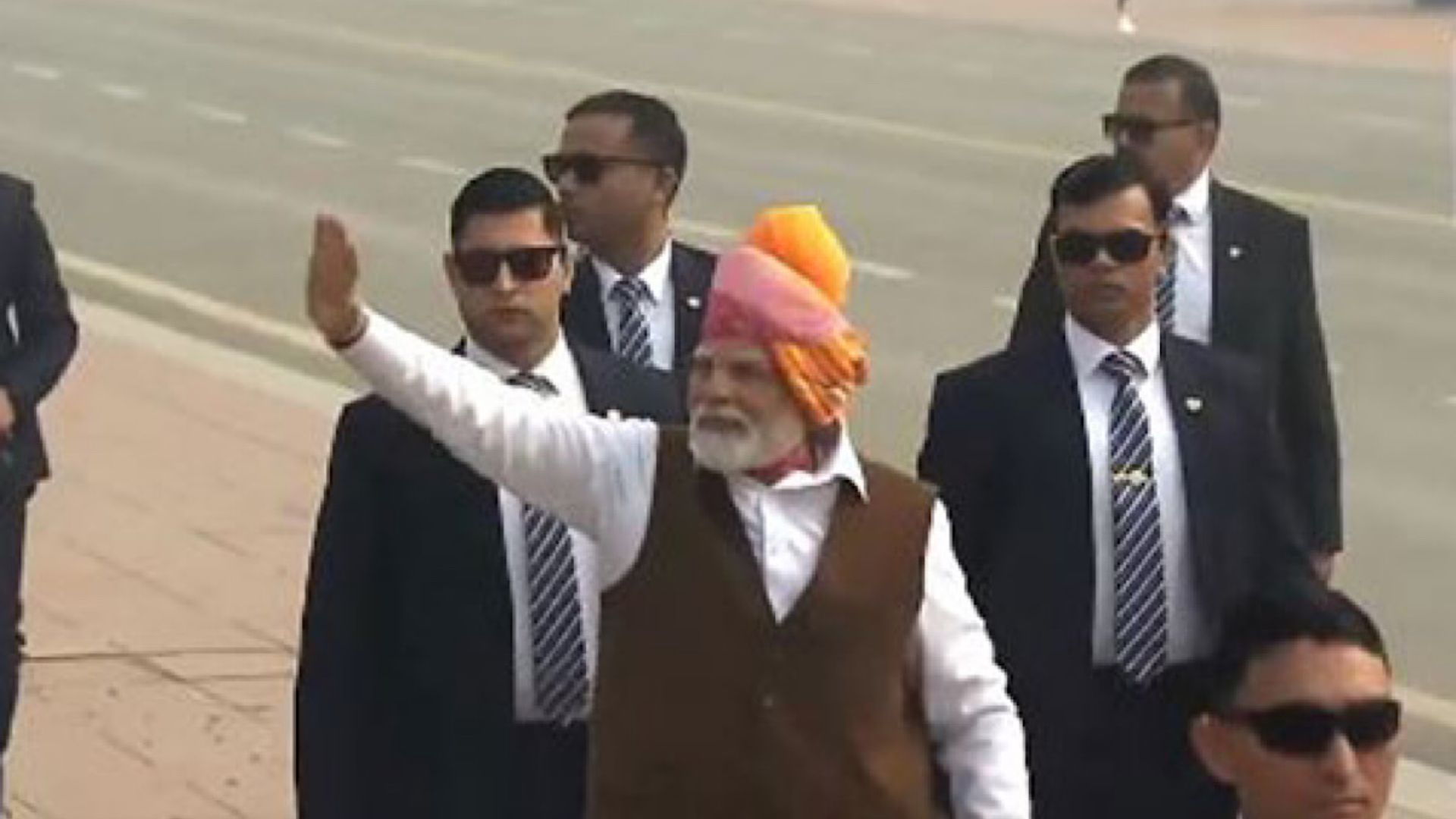 PM Modi waves at people on Kartavya Path following the conclusion of 75th Republic Day parade