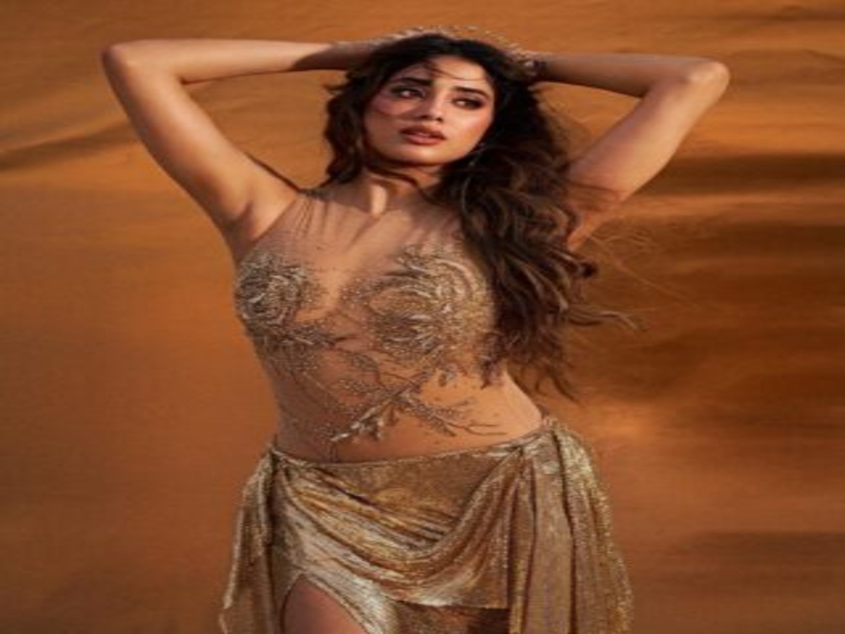 Janhvi Kapoor showcasing a bold golden outfit with intricate embellishments in a stunning photoshoot.