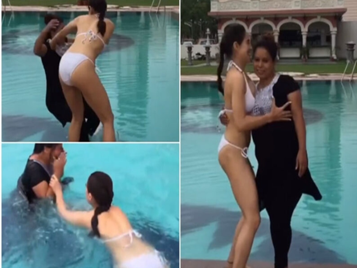 Sara Ali Khan smiling beside a pool moments before playfully pushing her staff member in