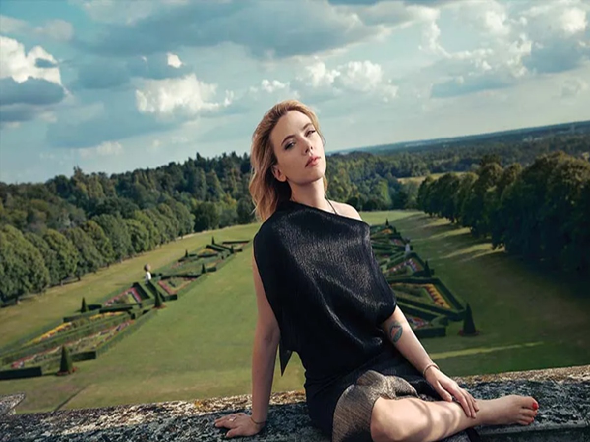 Scarlett Johansson seated during an interview, speaking confidently about her views