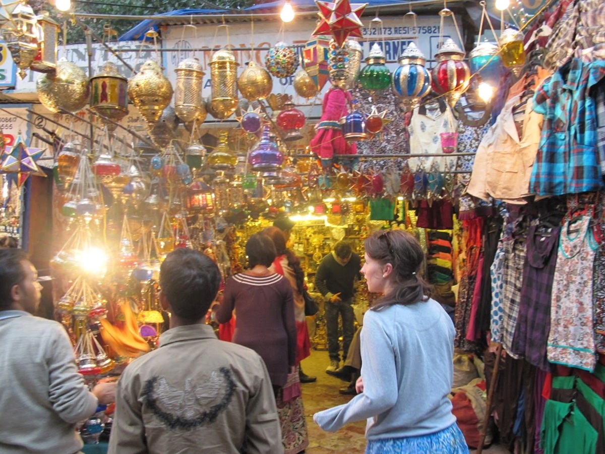 Bustling Paharganj Market in Delhi filled with shops, travelers, and local vendors