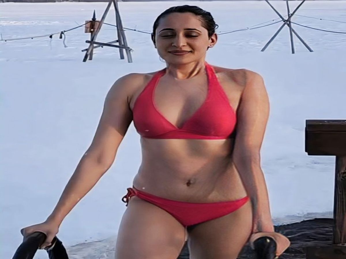 Pragya Jaiswal in a chic white monokini with a metallic chain