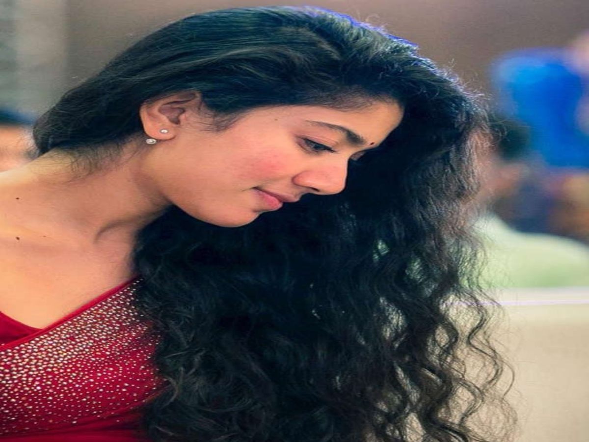 Model in a stunning red outfit with sparkling details