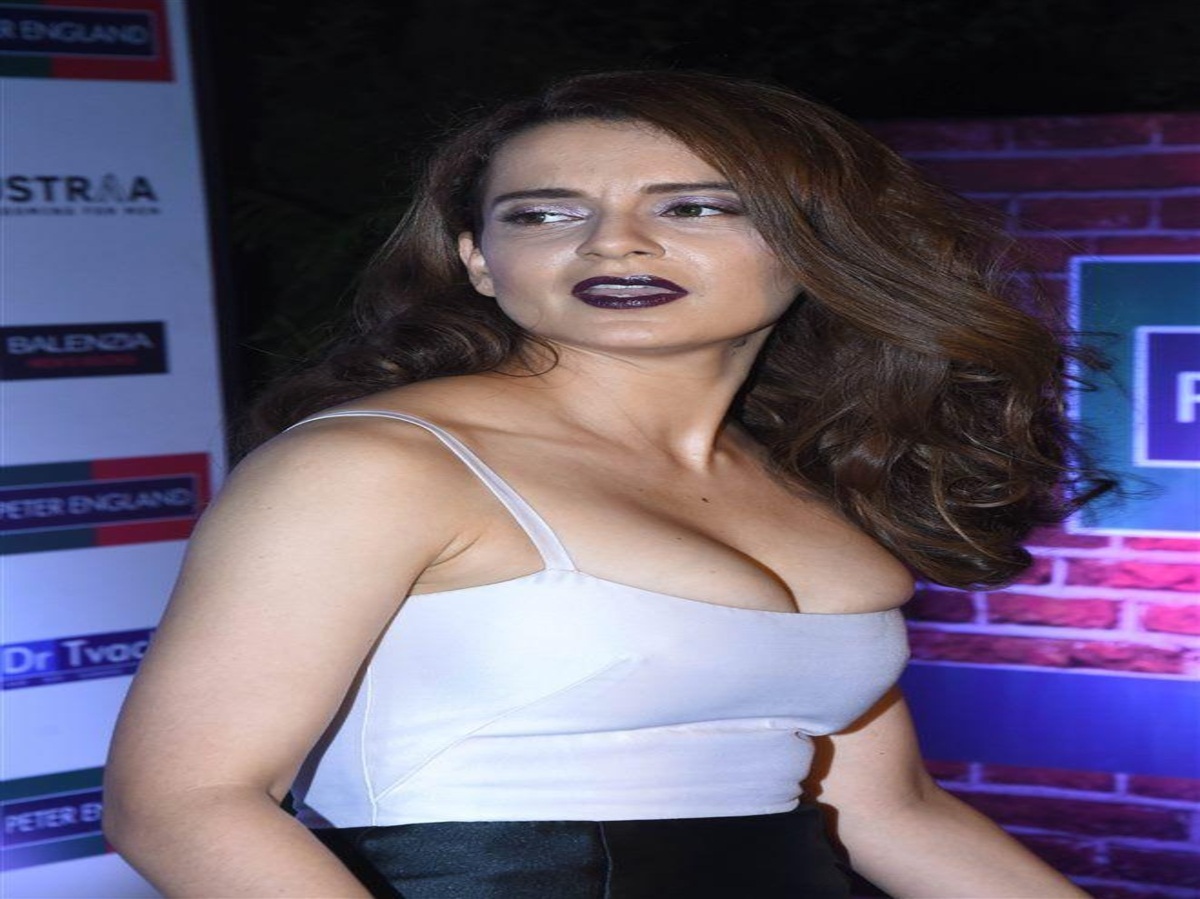 Kangana Ranaut in a tight-fitting dress at an event, showcasing an uncomfortable fit.