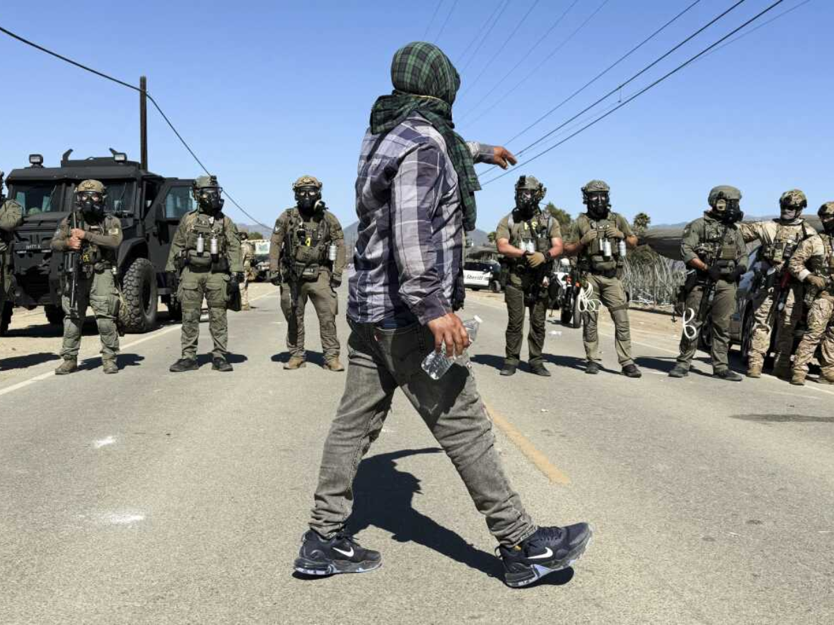 Protesters and federal agents clash during raid at Southern California farm
