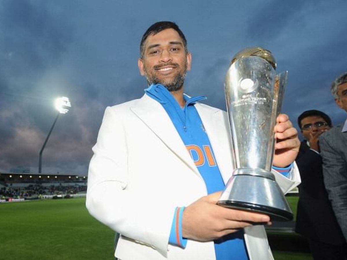MS Dhoni holding the ICC Champions Trophy 2013 after final win over England