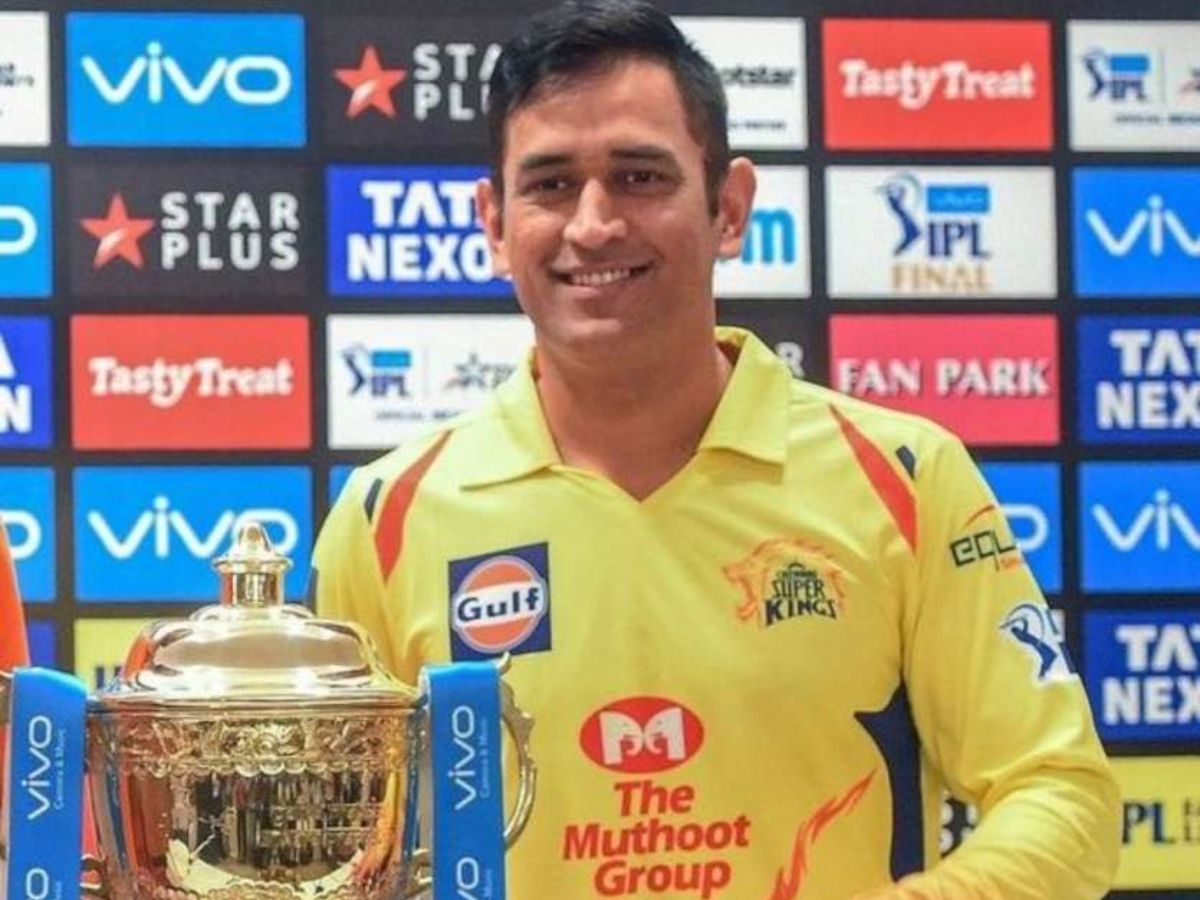Dhoni lifting IPL 2010 trophy with Chennai Super Kings teammates.