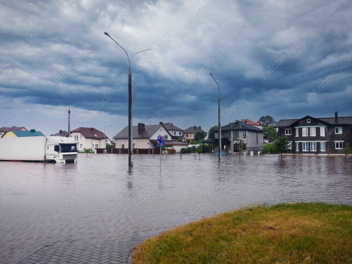 Aerial view of Texas neighborhood submerged in muddy floodwater.