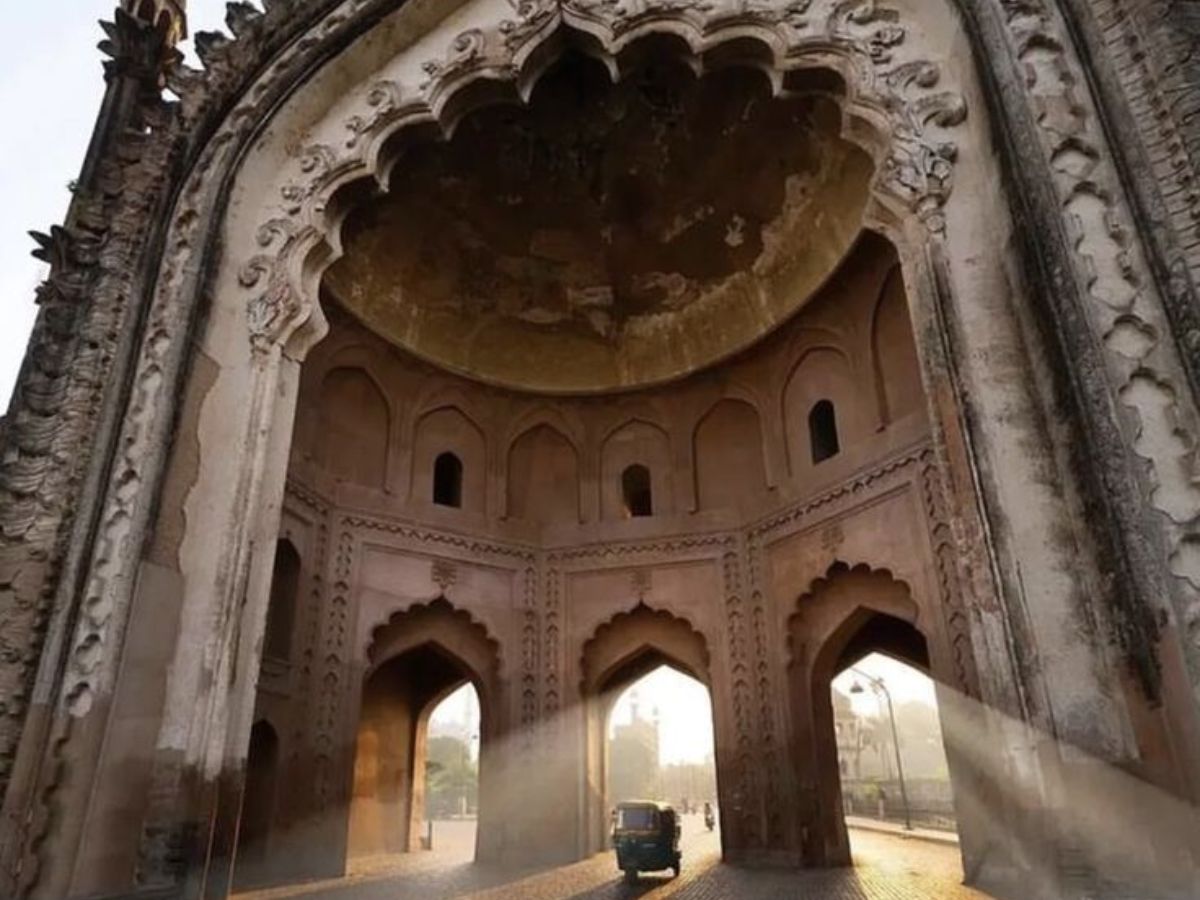 Iconic Rumi Darwaza glowing in the golden light of sunrise.
