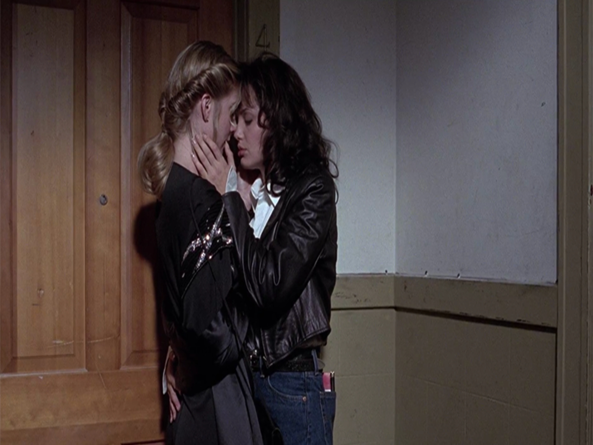 Angelina Jolie as Gia Carangi in a steamy scene from her breakthrough film.Angelina Jolie showcases her remarkable acting talent in the emotionally charged film about supermodel Gia Carangi, featuring strikingly intimate moments, including notable lesbian scenes with Elizabeth Mitchell.