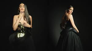 Sonam Kapoor showcasing a gilded gold sculpted metal corset