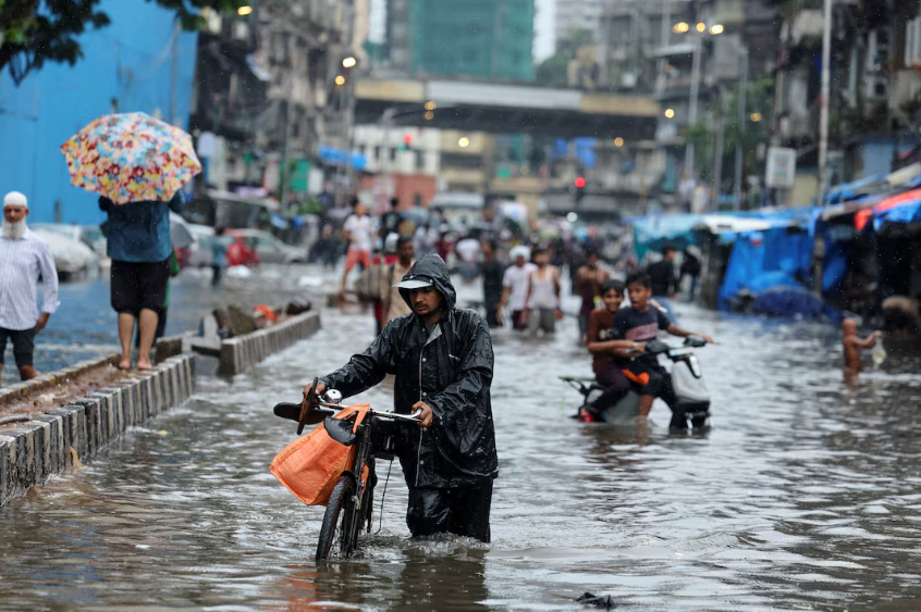 Vehicles in waterlogged Mumbai road