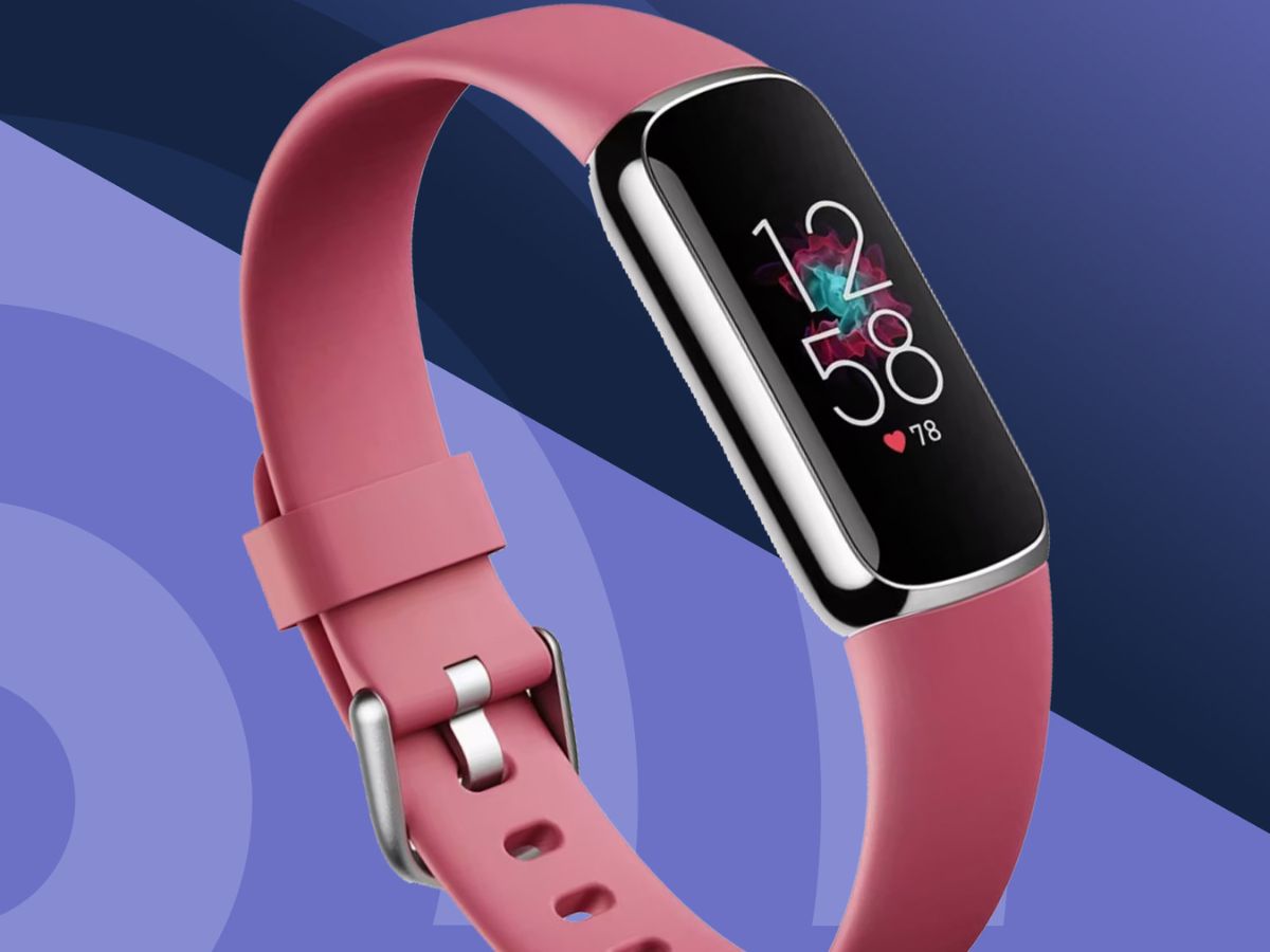 A stylish pink smartwatch with a metallic face displaying the time and a heart icon, shown at an angle to highlight its design.