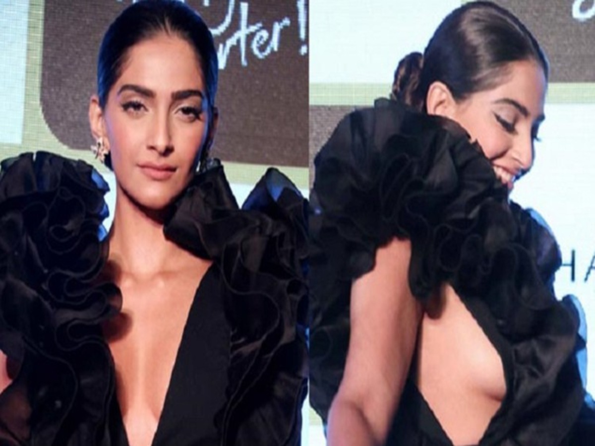 Sonam Kapoor Ahuja in a black gown at an event, looking uncomfortable with her fashion choice.