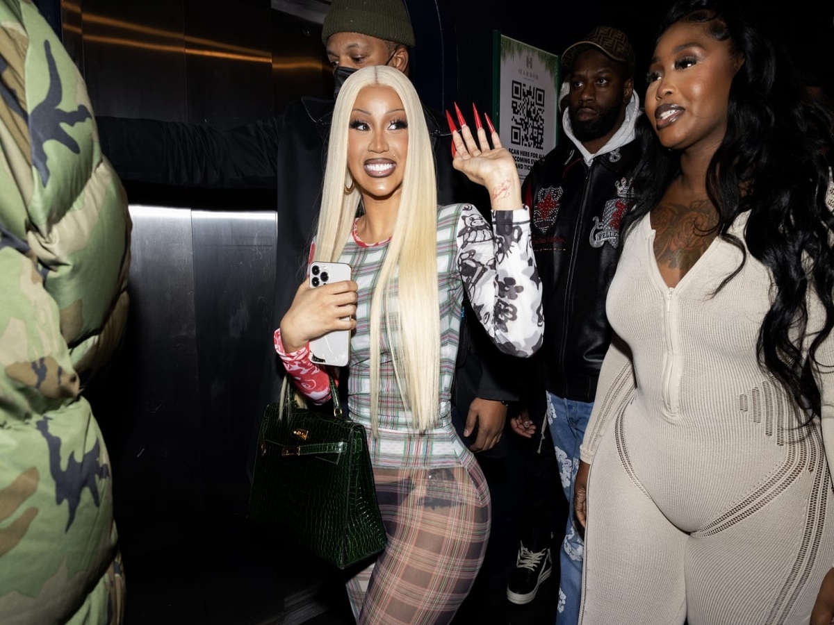 Cardi B discussing her plastic surgery journey during an Instagram Live, warning fans about the risks associated with illegal silicone injections and BBLs.