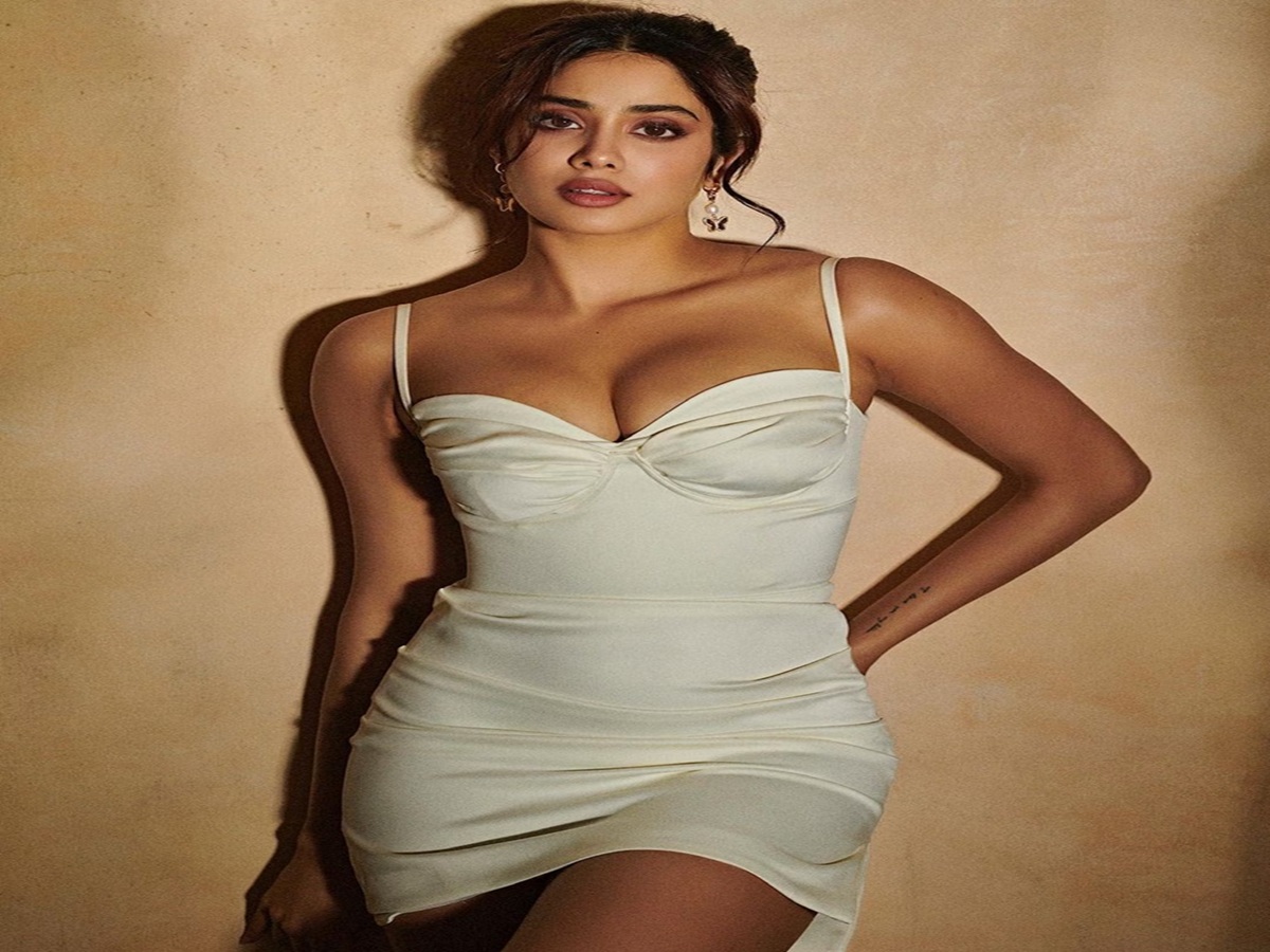 Janhvi Kapoor shines in a white dress with a plunging neckline, exuding elegance and timeless charm.