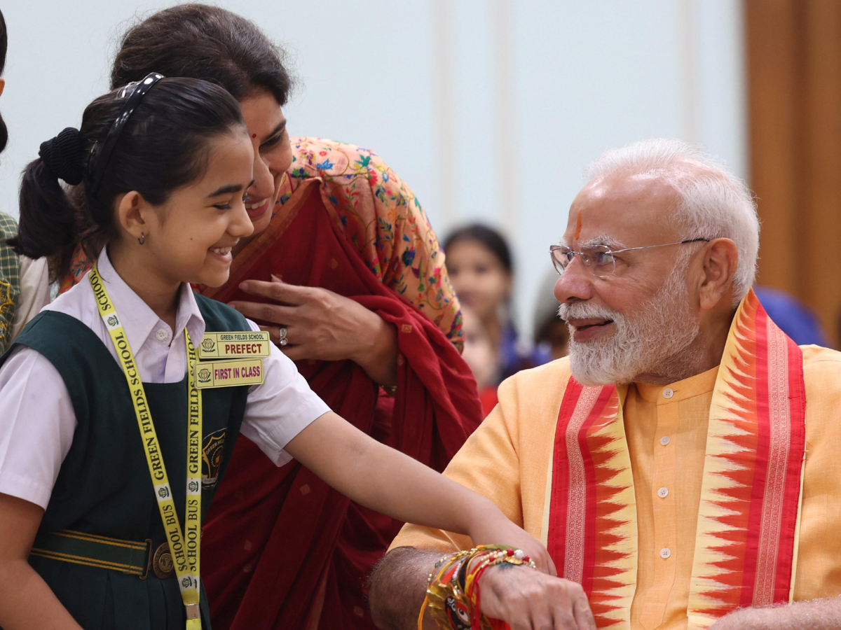 In Pics: Cute Pics Released Of PM Modi Celebrating Rakhi With School Kids