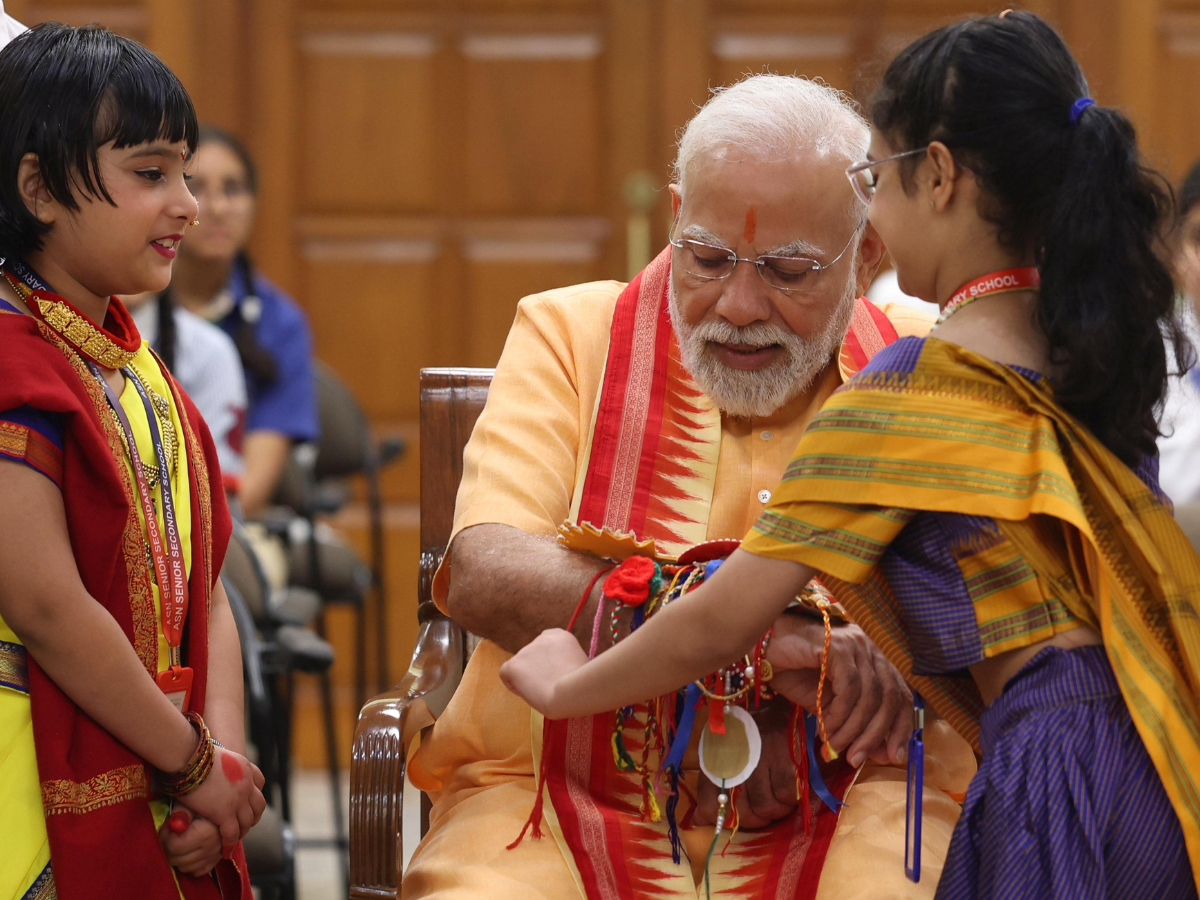 In Pics: Cute Pics Released Of PM Modi Celebrating Rakhi With School Kids