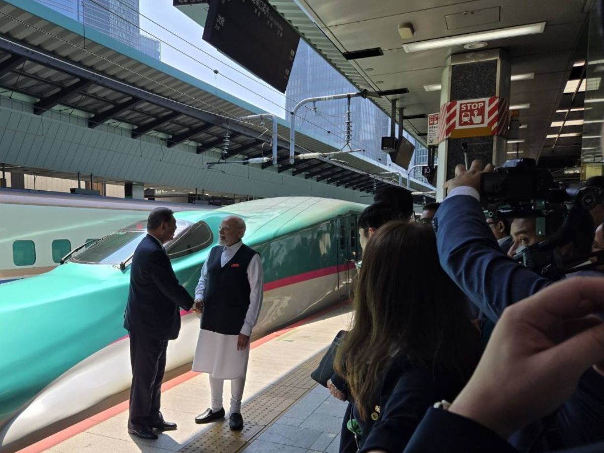 Japanese PM Shigeru Ishiba and PM Modi shake hands before taking a bullet train ride