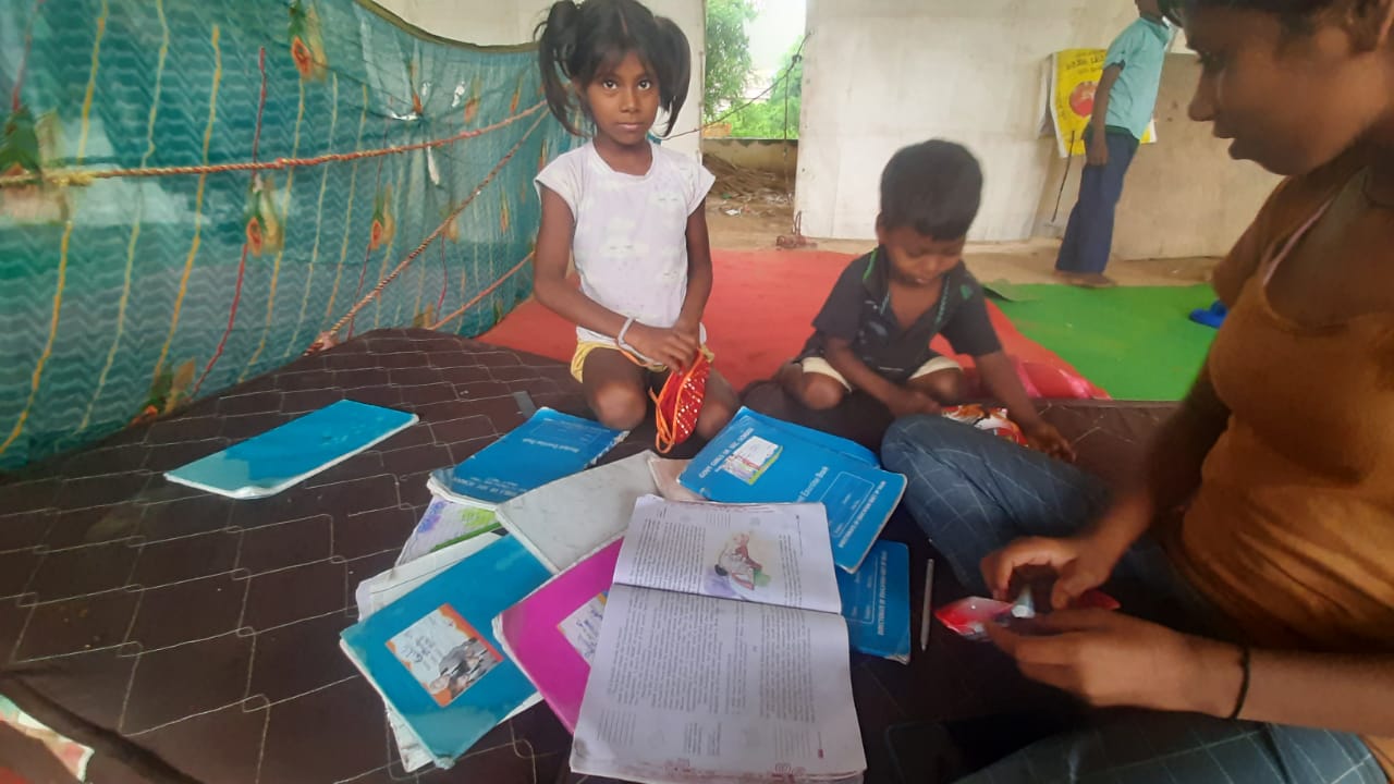 Children in Yamuna flood relief camps are studying despite the heavy rains and floods.