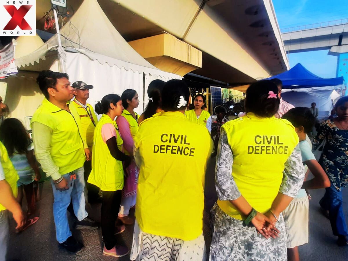 On the frontline of relief: Civil Defence volunteers coordinate efforts at a Yamuna flood camp.