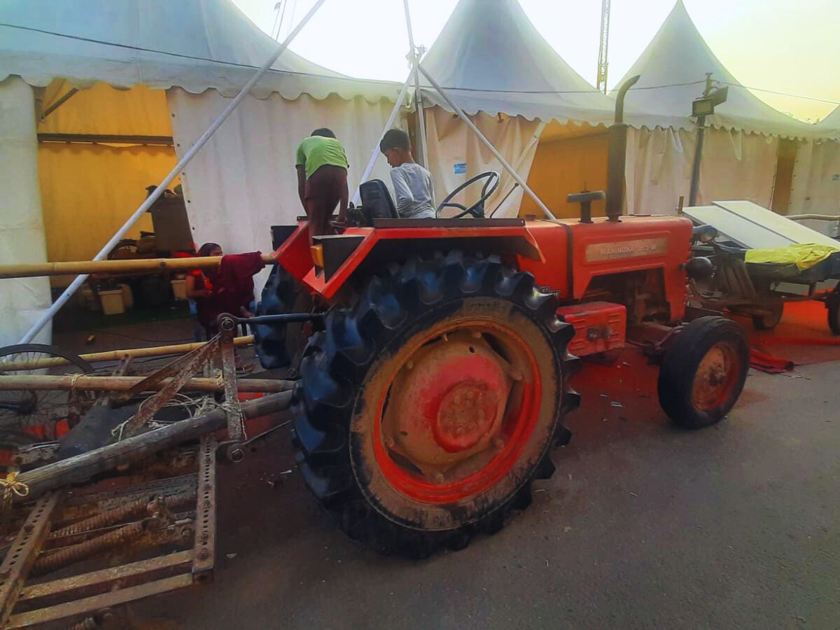 A tractor, parked in a relief camp, bears witness to the days of halted farming after the floods.