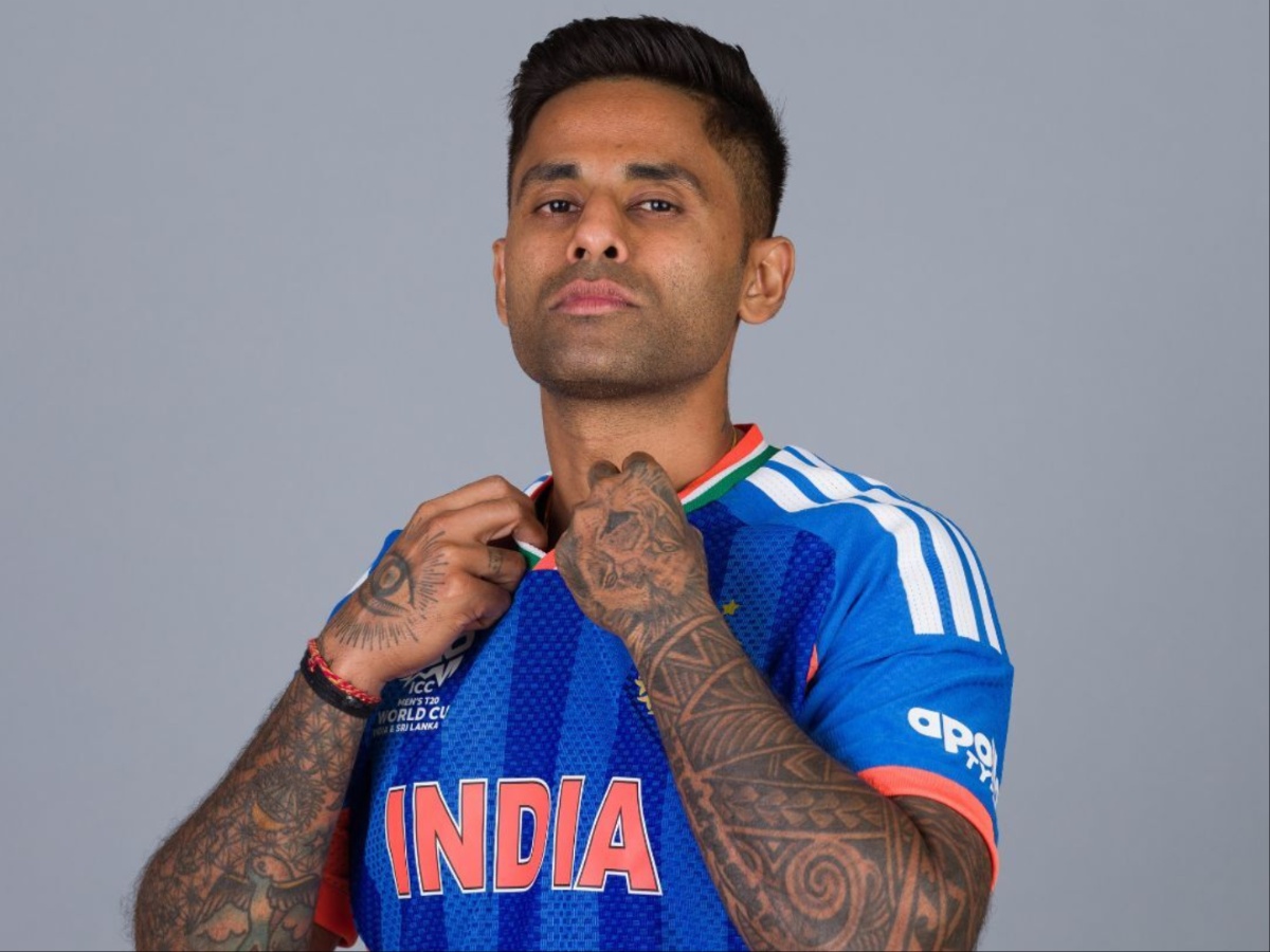 Suryakumar Yadav playing his signature "Supla" scoop shot in the India blue T20 kit, Suryakumar Yadav gesturing tactically while captaining India during the T20 World Cup 2026, Suryakumar Yadav celebrating a half-century in the Mumbai Indians blue and gold jersey