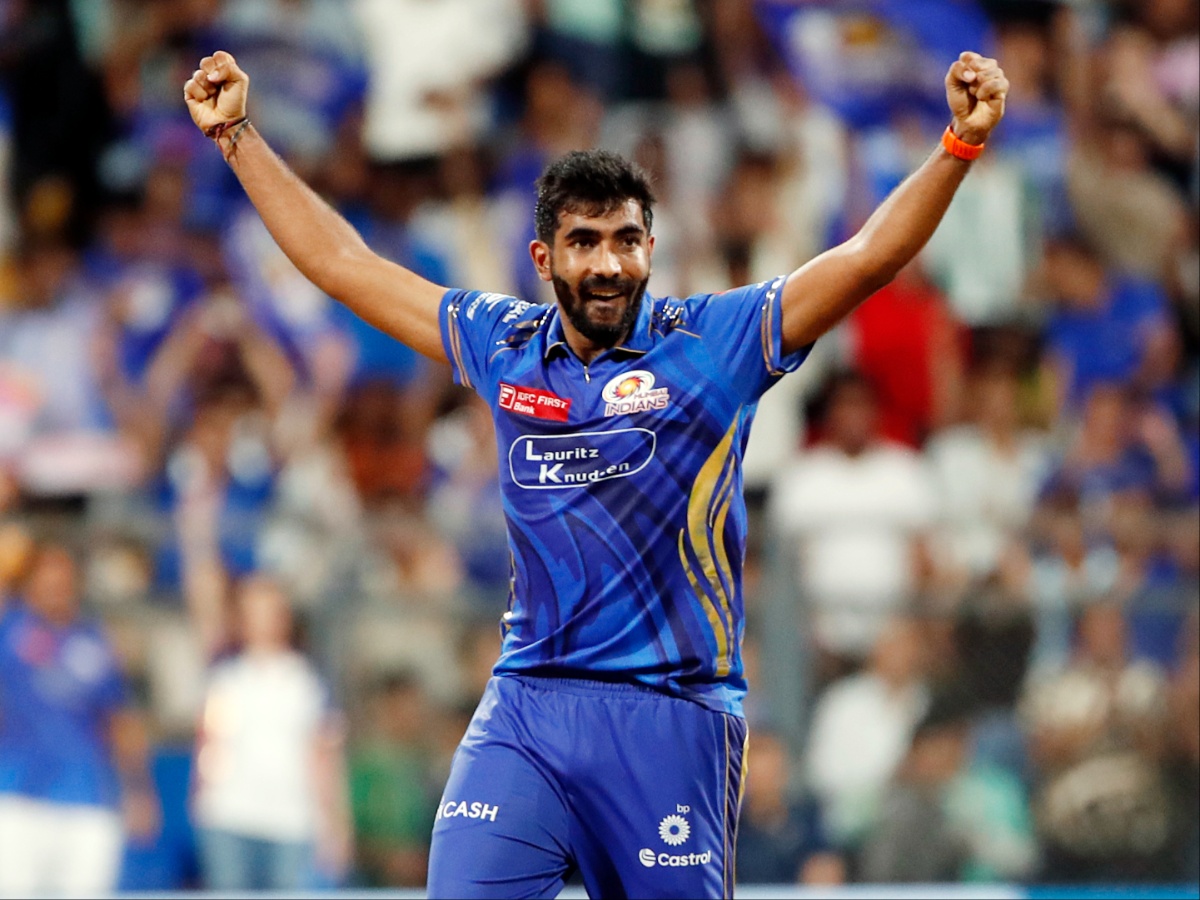 Jasprit Bumrah celebrating after a trademark yorker knocks over the stumps.