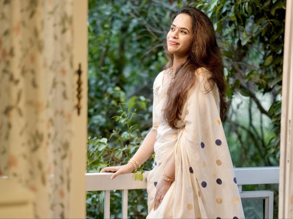 Sanju Samson posing with the T20 World Cup trophy alongside his wife Charulatha Remesh