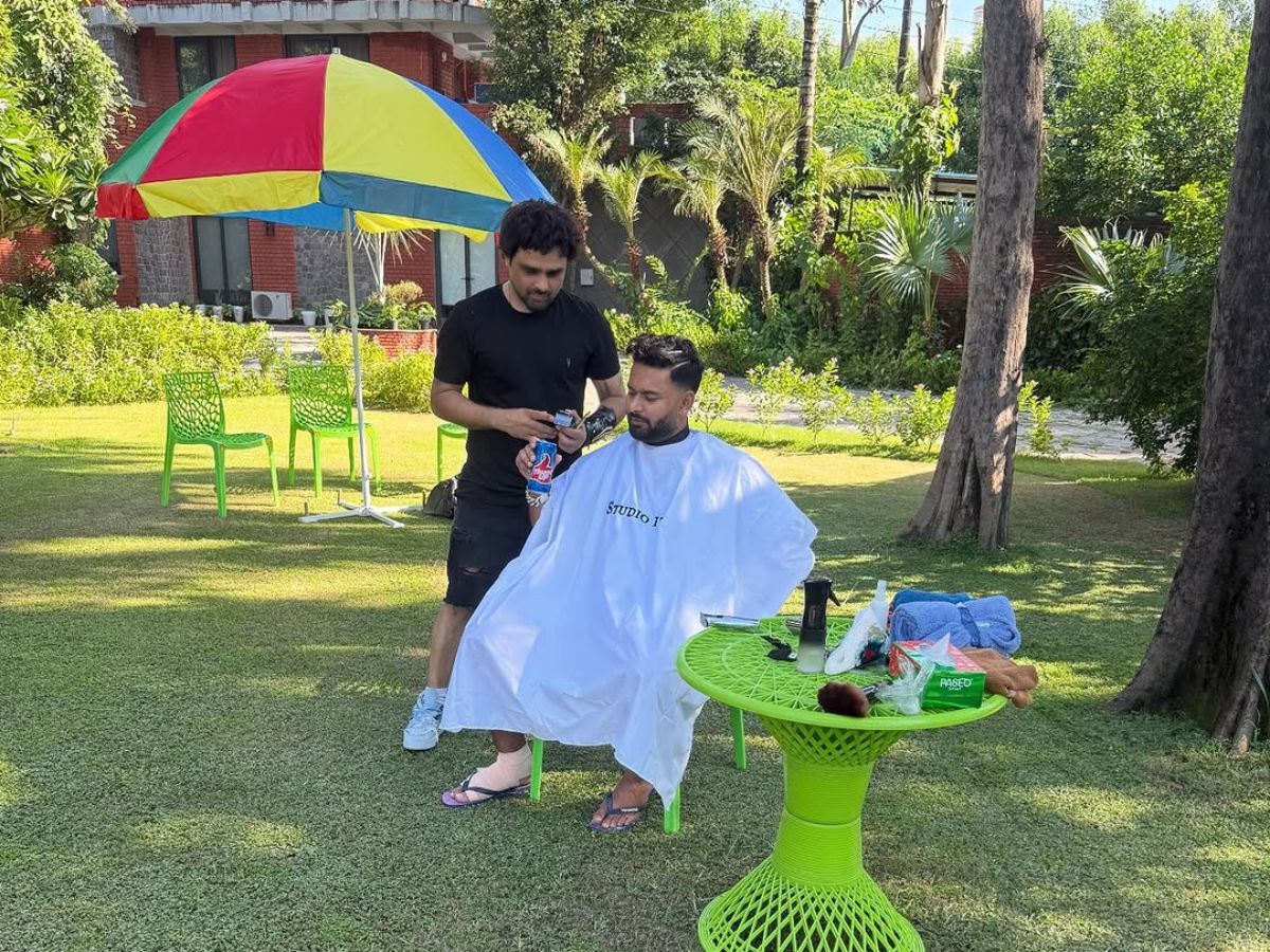 Rishabh Pant getting a haircut on his lawn