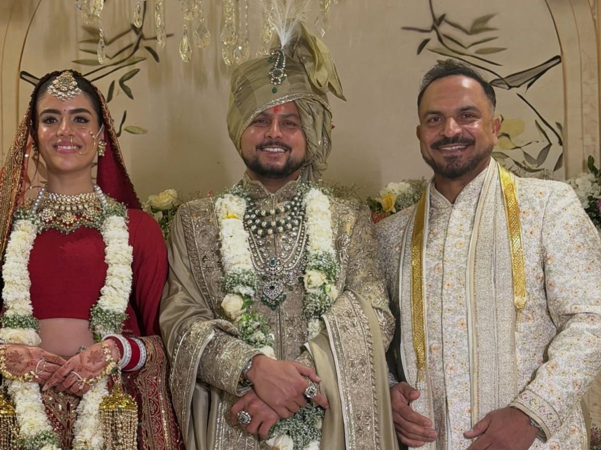 T Dilip gets clicked with Kuldeep and Vanshika